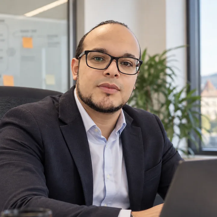 Portrait of the founder of REBORN at his desk